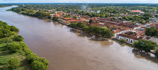 Wall Mural - Panoramic aerial view of the historic town Santa Cruz de Mompox and river in sunlight, Colombia, World Heritage