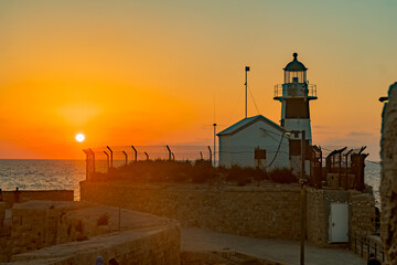 Wall Mural - Sunset view of the lighthouse, old city of Acre