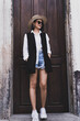 © Ann Patchanan - Fashionable woman with copy space stock photo.Cropped shot of a beautiful young female walking through the city