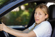 © auremar - young beautiful woman scared and stressed while driving car