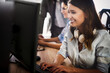 © NDABCREATIVITY - Successful happy woman working at office. Technology, computer, startup, business concept.