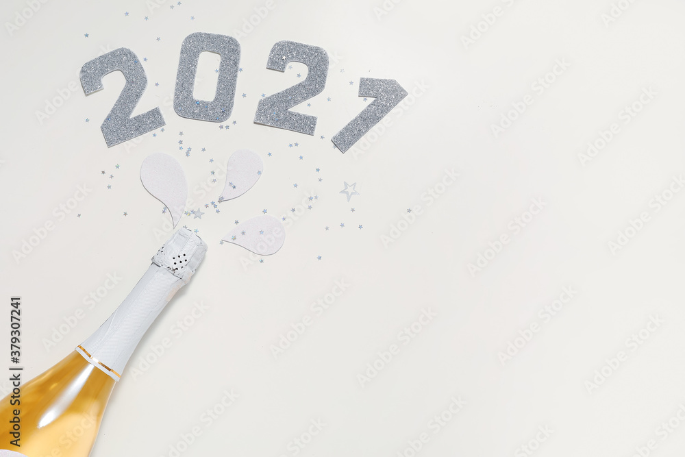 Christmas composition with bottle of champagne on white background