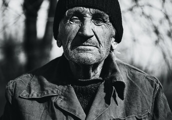 bw portrait of grandfather in coat and black hat