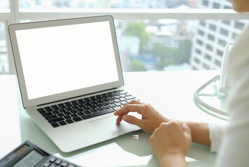 Wall Mural - using laptop computer with blank screen computer