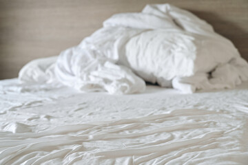 Wall Mural - close up unmade bed sheet in the bedroom after night sleep,white wrinkled fabic texture rippled surf