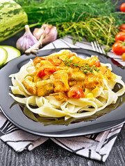 Wall Mural - Pasta with goulash in plate on napkin