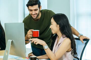 two young business people in smart casual discuss project look at computer screen in meeting room office, intern new employee, digital online marketing, business meeting startup concept