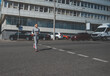 © Taras Grebinets - A young woman running on a crosswalk