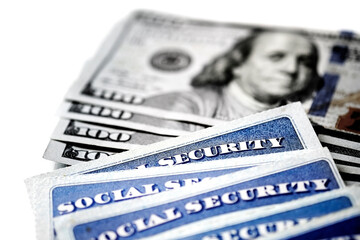 Wall Mural - Social Security Cards in a Row Pile for Retirement With Cash Money