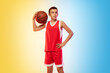© master1305 - Full length portrait of young basketball player in uniform on gradient studio background. Teenager confident posing with ball. Concept of sport, movement, healthy lifestyle, ad, action, motion.