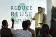 © Seventyfour - Portrait of young African-American man giving speech on recycling and waste management during conference, copy space