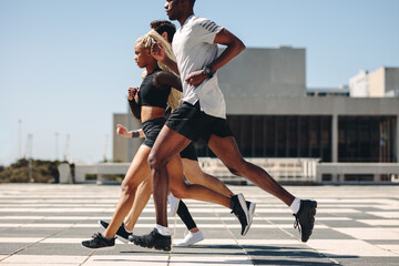 Wall Mural - Street runner exercising in the city