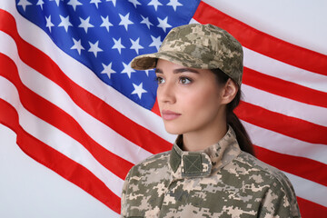 Wall Mural - Female soldier in uniform and United states of America flag on white background