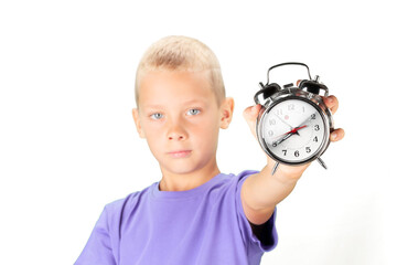 School boy showing alarm clock