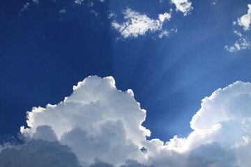 Beautiful blue sky with sunlight coming through clouds