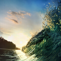 Fototapete - Tropical sunset background. Beautiful colorful ocean wave crashing closing near sand beach with palm tree
