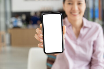 cell phone mockup blank white screen.woman hand holding texting using mobile on desk at coffee shop.background empty space for advertise.work people contact marketing business,technology