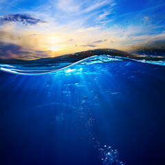 Wall Mural - design template with underwater part and sunset skylight splitted by waterline