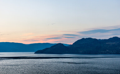 Wall Mural - cloudy sky seen from the shore of Okanagan lake at night British Columbia Canada