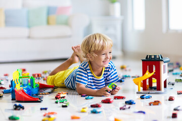 Kids play with toy cars. Children playing car toys