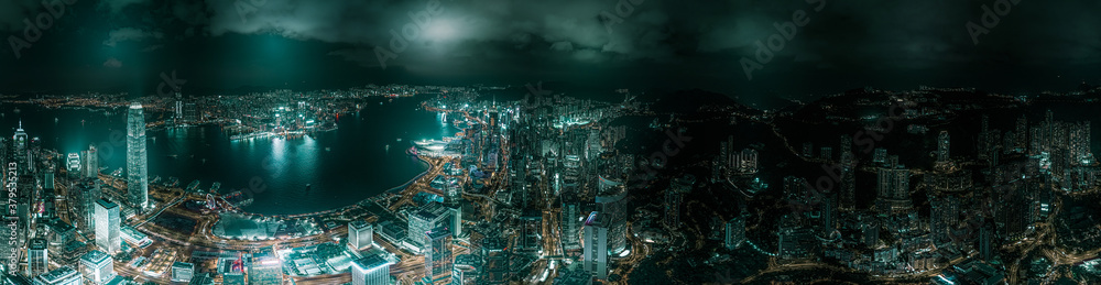 Top view aerial photo from flying drone of a developed metropolitan city in Hong Kong with office skyscrapers. - obrazy, fototapety, plakaty 