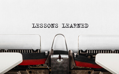 Wall Mural - text lessons learned typed on typewriter