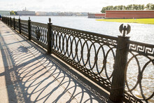 Promenade With Views Of The River, The Prospect Of Chains Fencing Waterfront Forging Metal.Fragment Fencing Of Bridge In Saint Petersburg, Russia.City Landscape , Bridge Near Peter And Paul Fortress