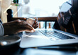 © SHOTPRIME STUDIO - business man in a cafe at the table in front of a laptop work a cup of coffee at the table communication technology