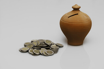 Sticker - Closeup of euro coins near a clay bank isolated on a white background