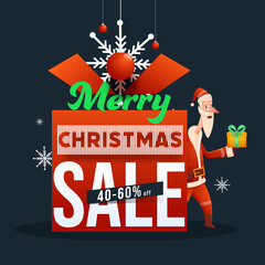 Wall Mural - Merry Christmas Sale Poster Design with 40-60% Discount Offer, Snowflakes, Hanging Baubles and Santa Claus Holding a Gift on Dark Grey Background.