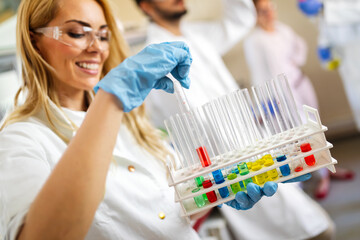 Young attractive female scientist researching in the laboratory