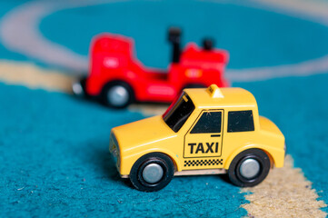 Wall Mural - Selective focus shot of toy cars on the carpet