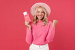 © Drobot Dean - Image of excited woman posing with passport and making winner gesture