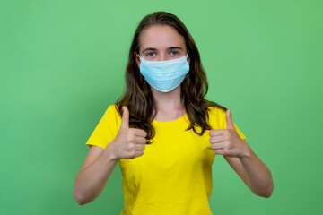 British young adult woman recommending face mask against covid-19 infection