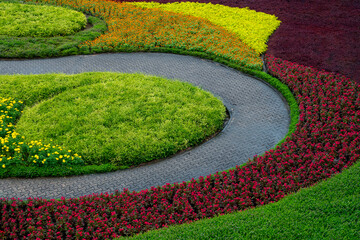 Canvas Print - Colorful flowers and walkways in the park.