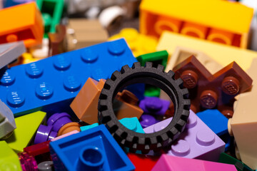 A close up of a tyre or tire amongst bricks or building blocks