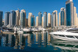 © Oleksandr - Jacht and Skyscrapers Above the Water of Persian Gulf in Dubai Marina District in UAE