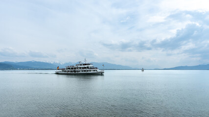 Lindau, Germany - May 2 2019: Karlsruhe Cruise Ship approaching the port of Lindau, on Lake Constance (Bodensee)