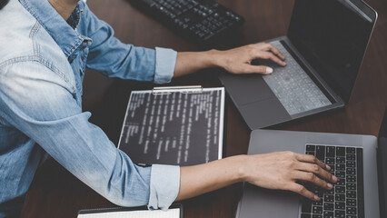Wall Mural - programmer working in a software development and coding technologies. website design. technology con