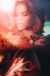 Leinwanddruck Bild - Fantasy portrait. Nature inspiration. Double exposure defocused silhouette of peaceful woman flowers in red bokeh light with old film dust scratches stains effect. Tranquility tenderness.
