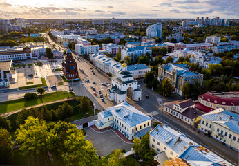 a panoramic view of the old city district with ancient buildings and a church filmed from a drone