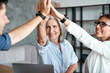 © insta_photos - Happy mature old female mentor teacher executive giving high five to young enthusiastic employees, interns, students united team as teamwork support, professional leadership and partnership concept.