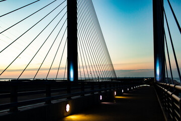 Wall Mural - steel bridge over waterway evening sky