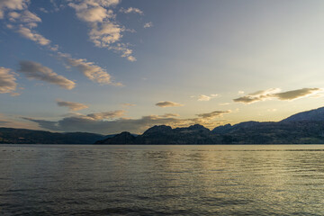 Wall Mural - cloudy sky seen from the shore of Okanagan lake at morning British Columbia Canada