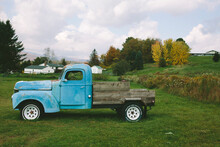 Old Blue Truck In A Field
