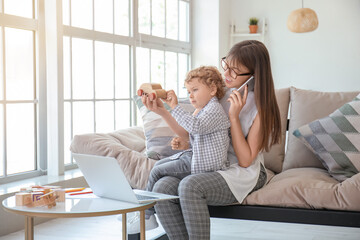 Sticker - Working mother with little son at home