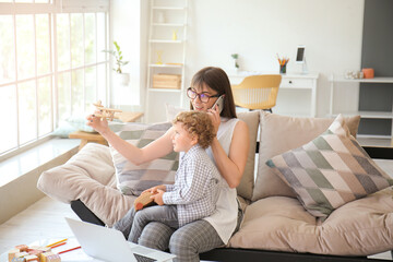 Sticker - Working mother with little son at home