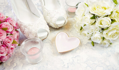 Wall Mural - White aesthetic wedding bridal theme desktop workspace with high heel shoes, bouquets and accessories on stylish white textured background. Top view blog hero header creative composition flat lay.