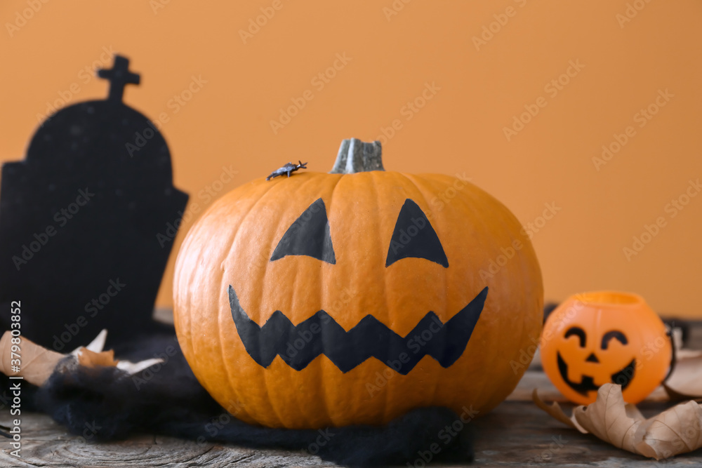 Composition with Halloween pumpkin on table