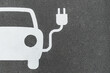 © Mellimage/Stocksy - Parking spot for an electric car, charging station